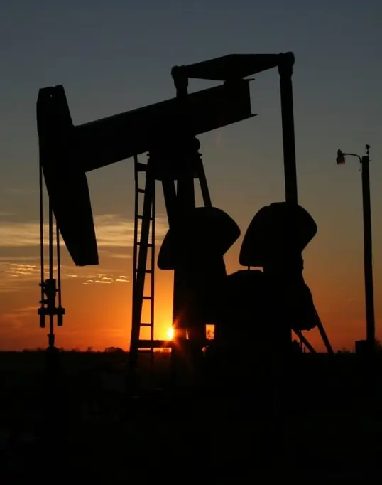 Oil drilling rig at dawn