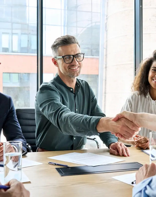 Two business professionals shaking hands